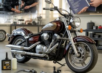 Mechanic performing Yamaha Star oil maintenance on a 2005 cruiser motorcycle engine